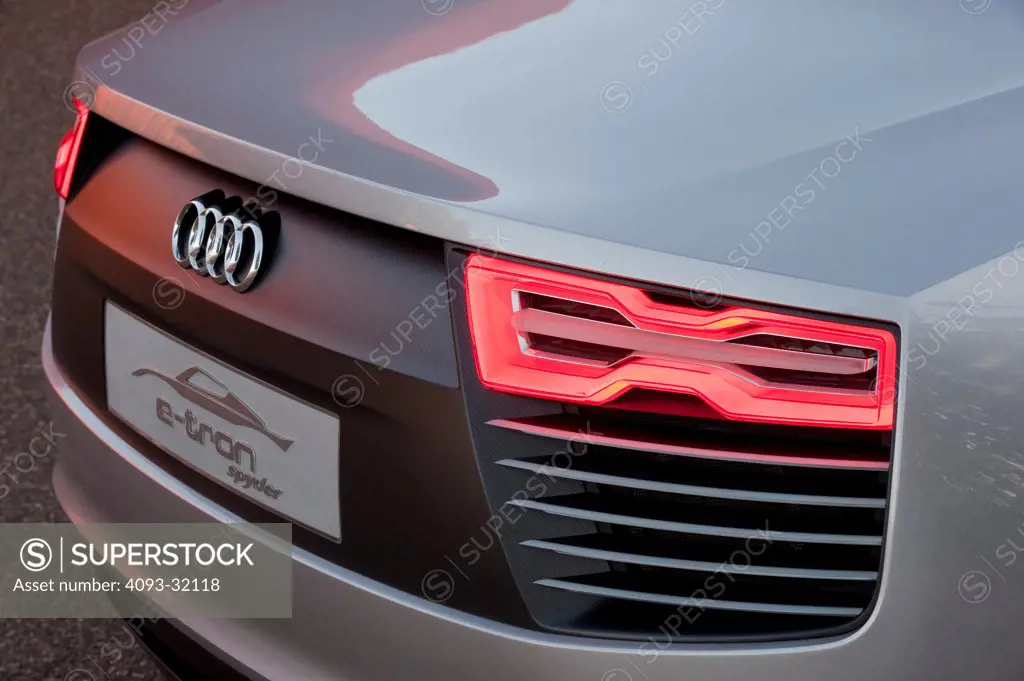 Detail of the rear section of an Audi e-tron Spyder Concept showing the badge and tail light.