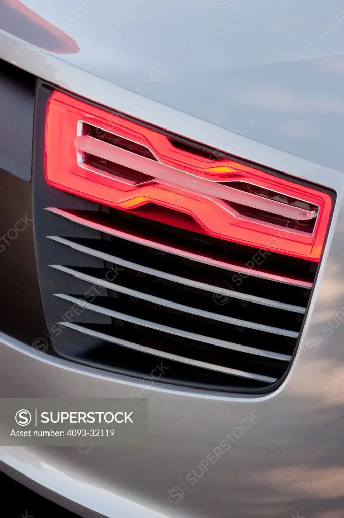 Detail of the rear section of an Audi e-tron Spyder Concept showing the tail light.