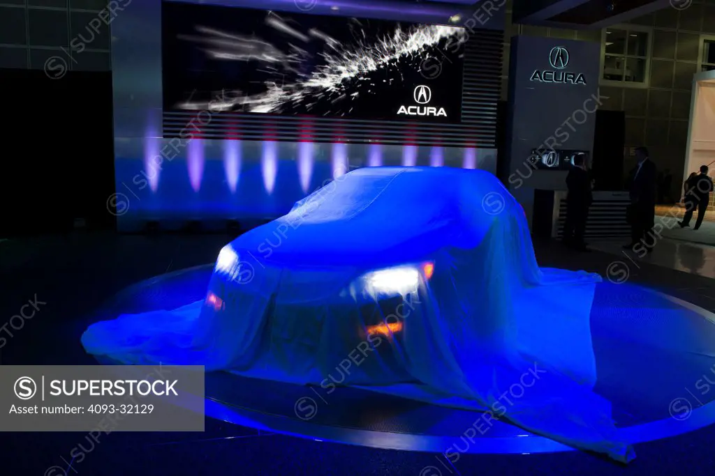 2014 Acura RLX still under a drop cloth cover at the 2012 Los Angeles Auto Show