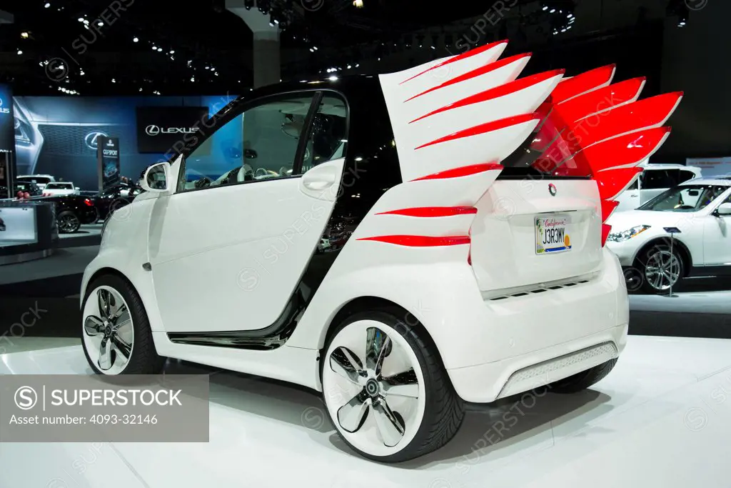 Rear 3/4 view of a white Smart Forjeremy concept at the 2012 Los Angeles Auto Show