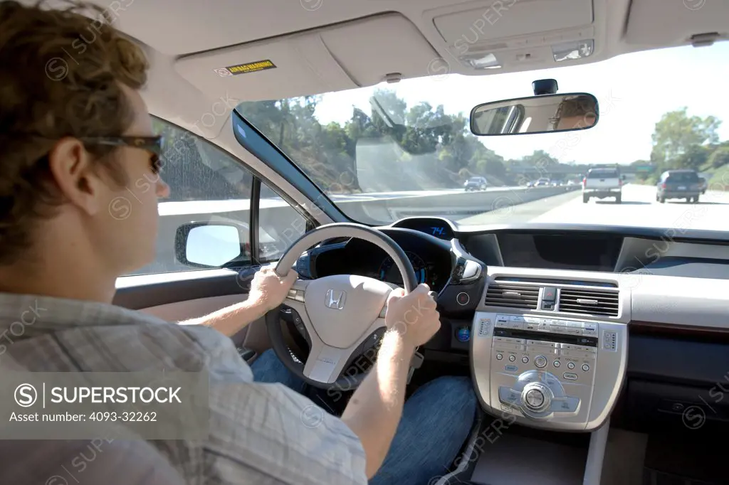2010 Honda Clarity Hydrogen Fuel Cell sedan hatchback driving on a freeway in California, rear interior view