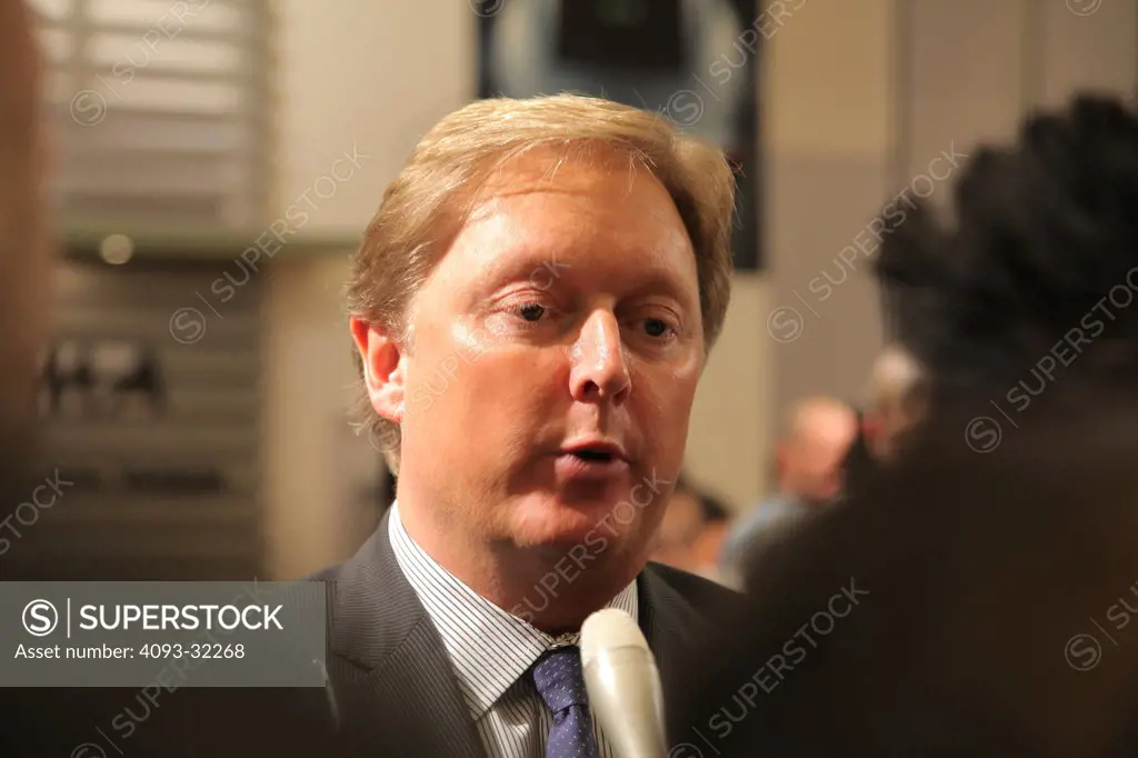 Henrik Fisker, CEO and founder of Fisker Motor Cars speaking to reporters at an auto show.