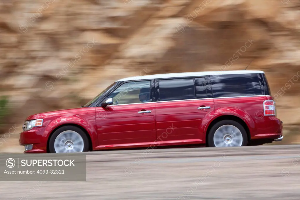 2010 Ford Flex SUV crossover on mountain road, side view