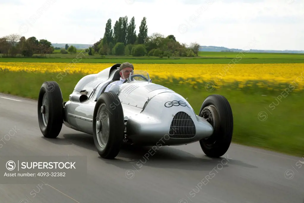 1939 Auto Union D Type race car winner of the 1939 French Grand Prix, on country road, front 3/4