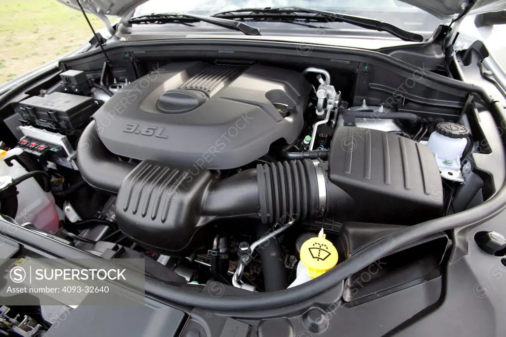 Engine view of a silver 2012 Dodge Durango showing the 3.6 liter V6 motor.