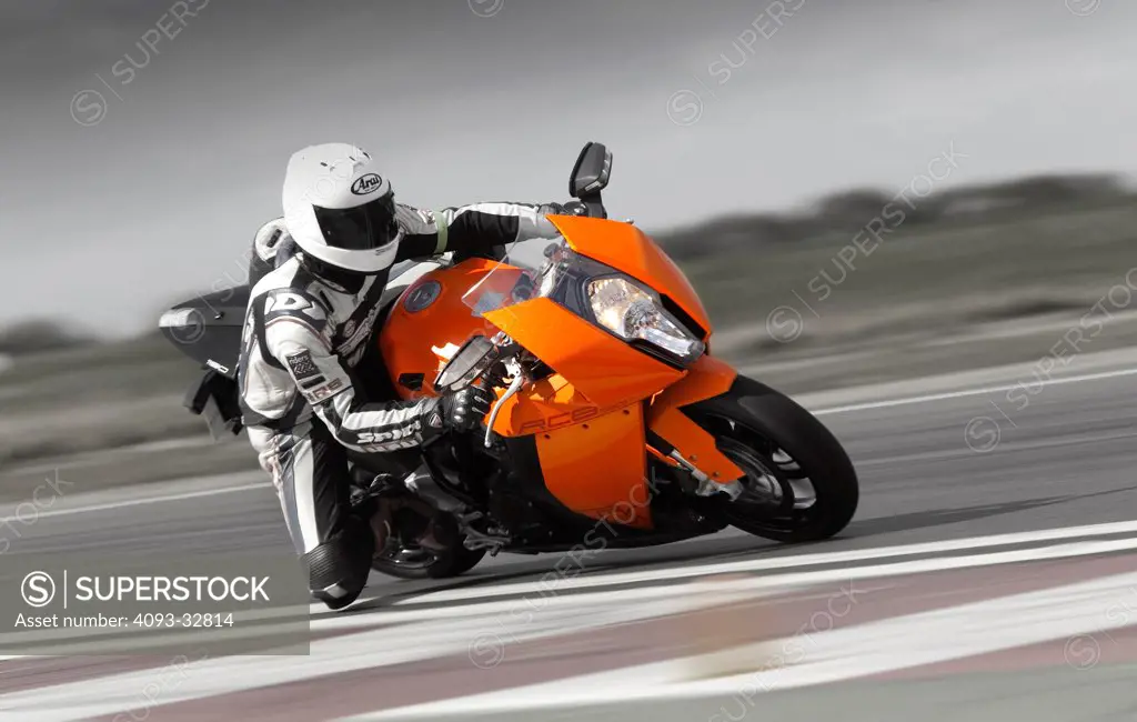 2010 KTM 1190RCB at speed on race track, front 3/4