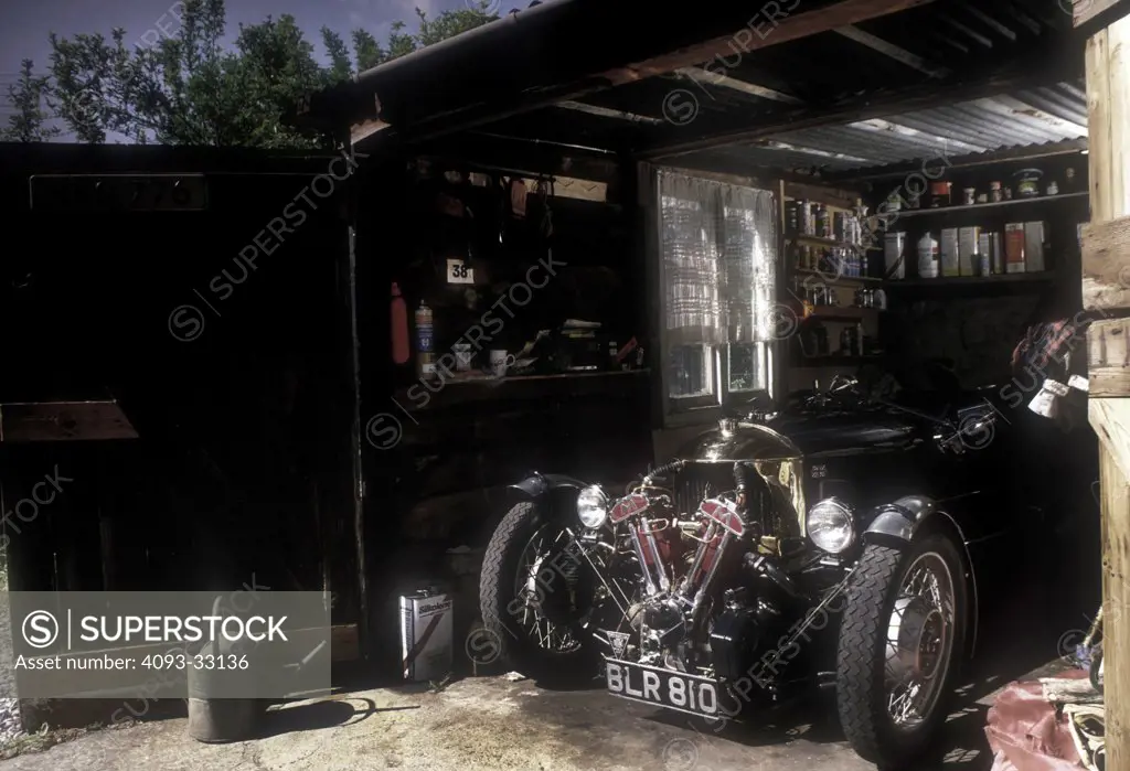 1934 Morgan Matchless three-wheeler car in garden garage, front 3/4