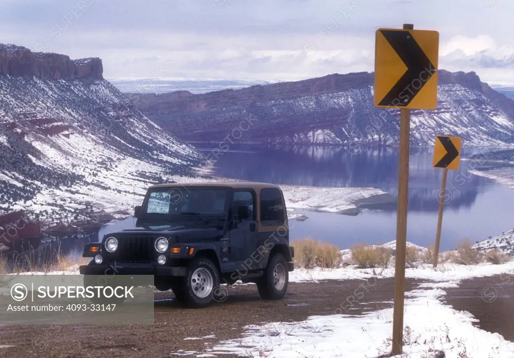 2010 Jeep Wrangler parked by lake, front 3/4