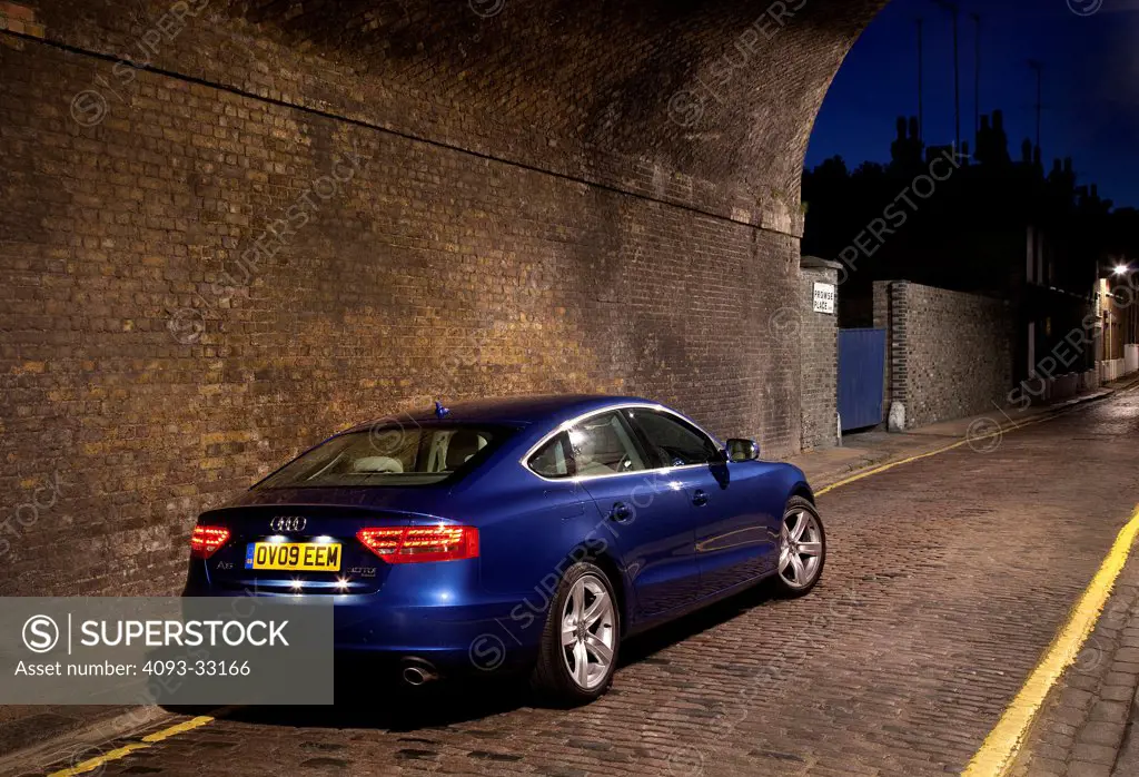 2011 Audi A5 Sportback parked in brick tunnel, rear 3/4
