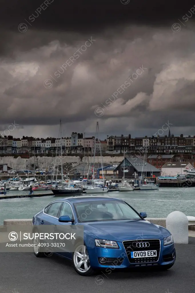 2011 Audi A5 Sportback parked next to harbor, front 3/4