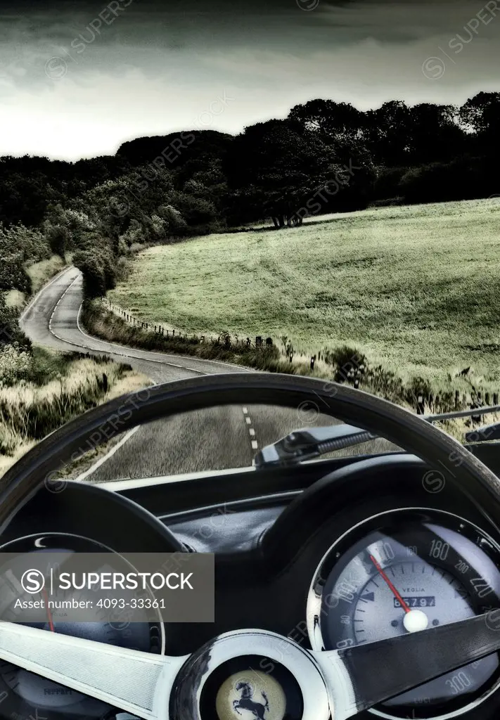 Driver's Point of View of a curving country lane from a ferrari.