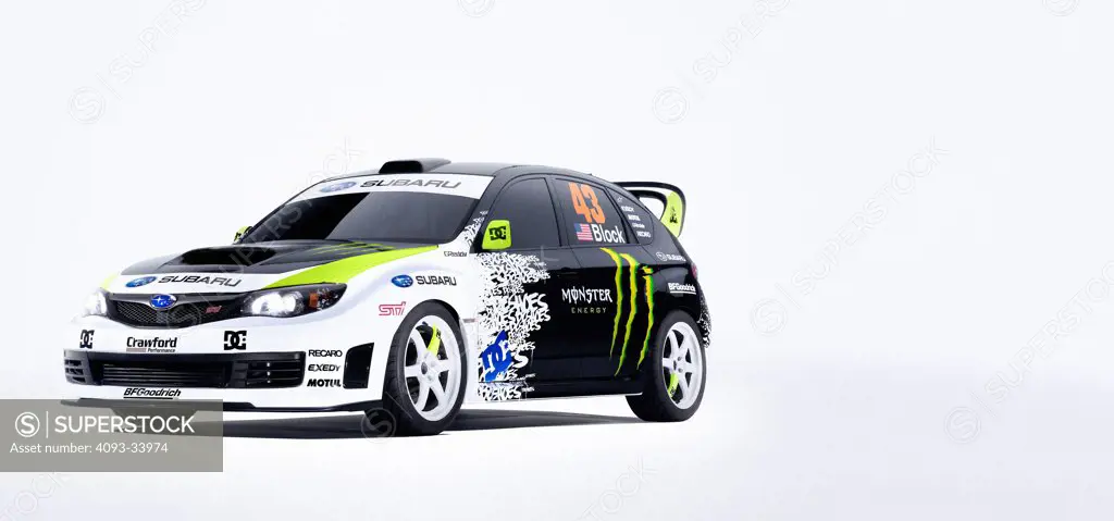 Front 3/4 static view of a Ken Block 2009 Subaru WRX STi in the studio with white background.