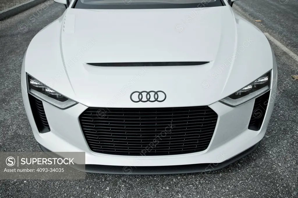 Exterior detail of the white 2010 Audi Sport Quattro Concept showing the large front grill, headlights and badge logo.