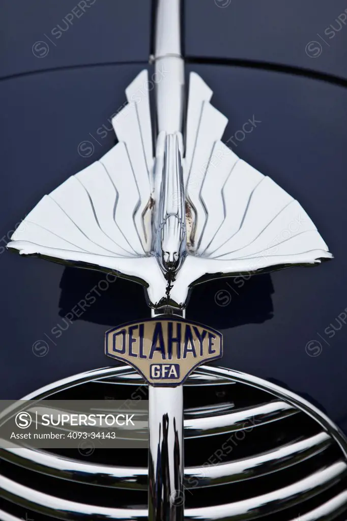 Exterior detail of a blue 1947 Delahaye 135 MS Chapron Cabriolet showing the unique flying woman Hood Ornament