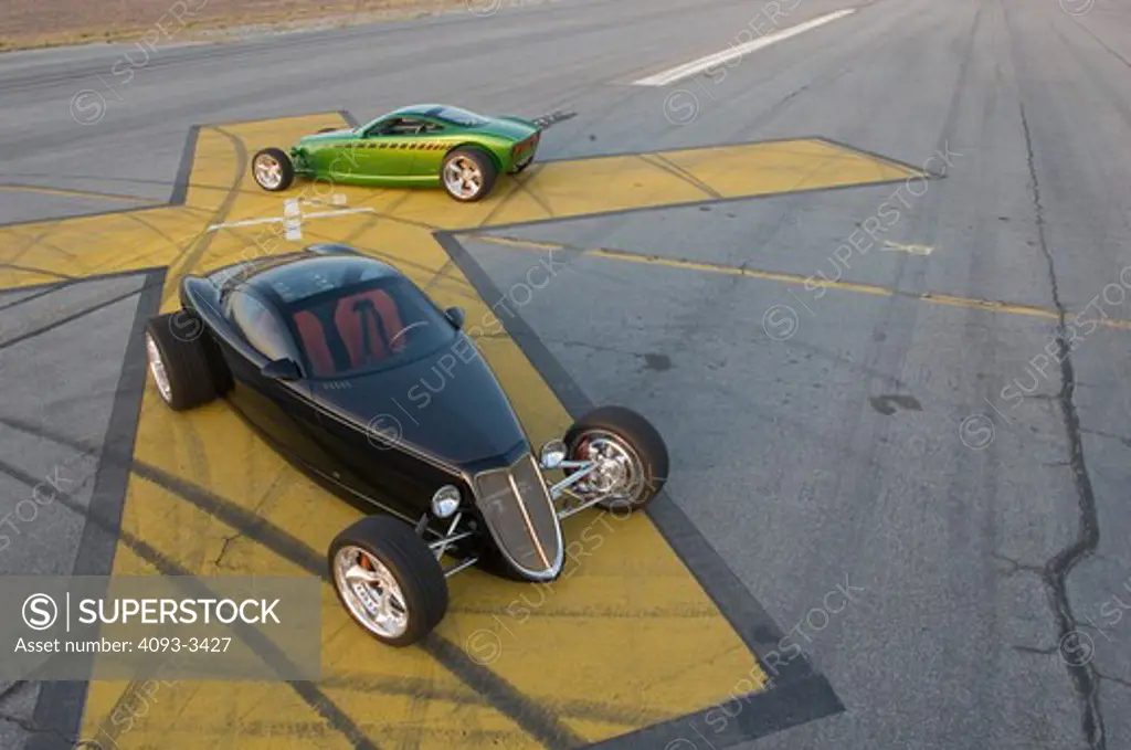 2007 chip foose coupe hot rod. The Hemisfear is an all-aluminum, two-seater, mid-engine car. two parked on a runway