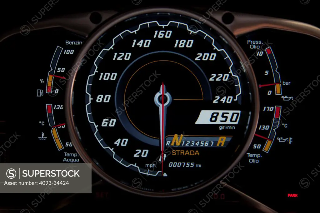Interior detail view of a 2012 Lamborghini Aventador showing the instrument panel and speedometer.