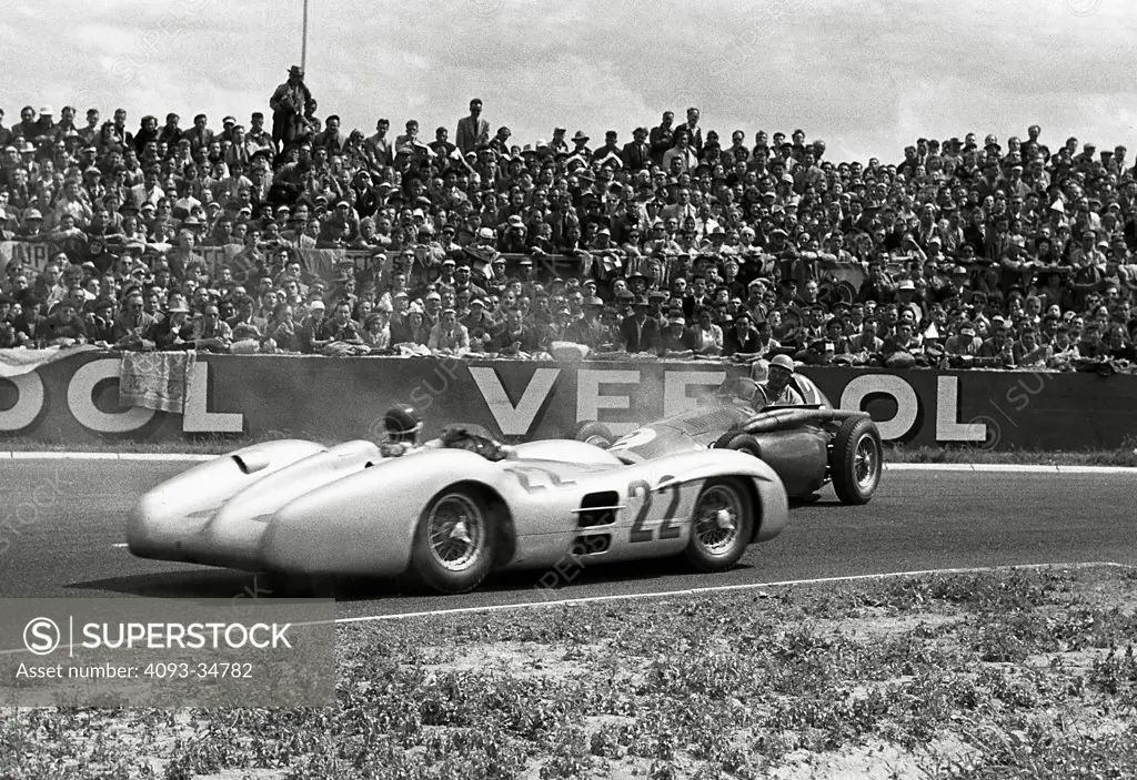 The 1954 french Grand Prix at Reims; Fangio passes Froilan Gonzalez, who appears to have spun in his Ferrari's oil.