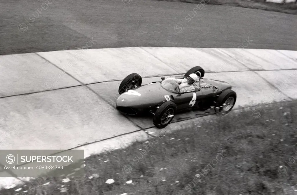 Phil Hill in his Ferrari Dino 156 on his way to winning the 1961 German Grand Prix at the Nurburgring.