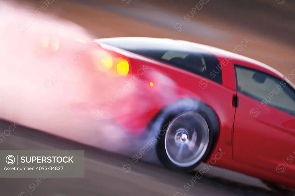 Rear wheel burnout action view 2010 Chevrolet Corvette Grand Sport.