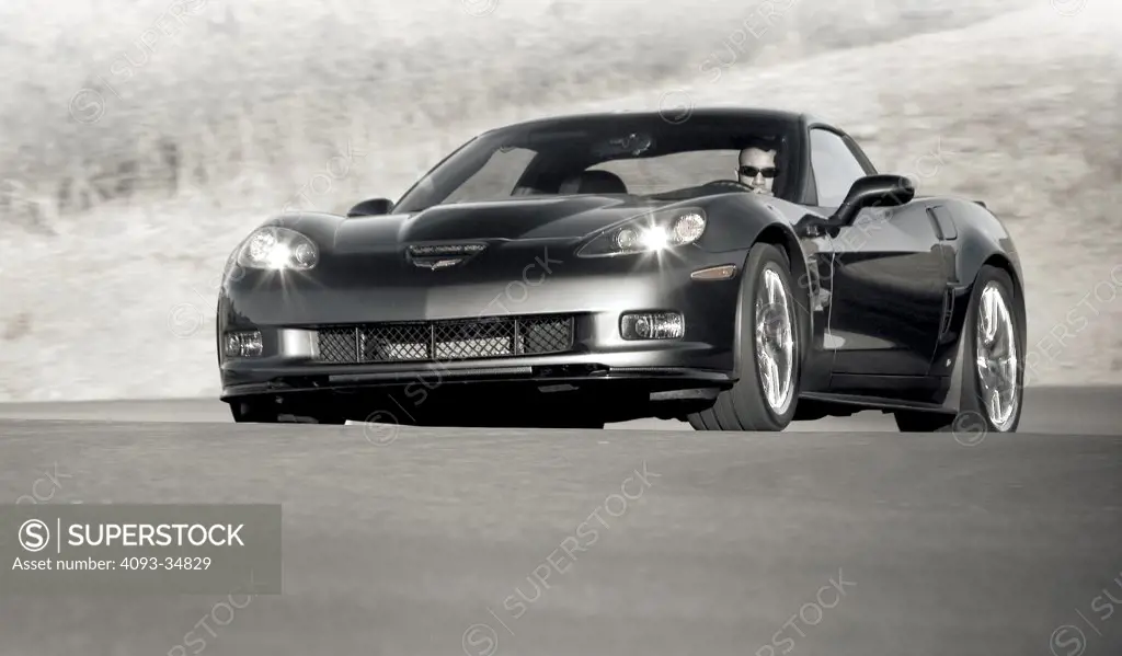 Front 3/4 action of a 2010 Chevrolet Corvette ZR1. Black & White.