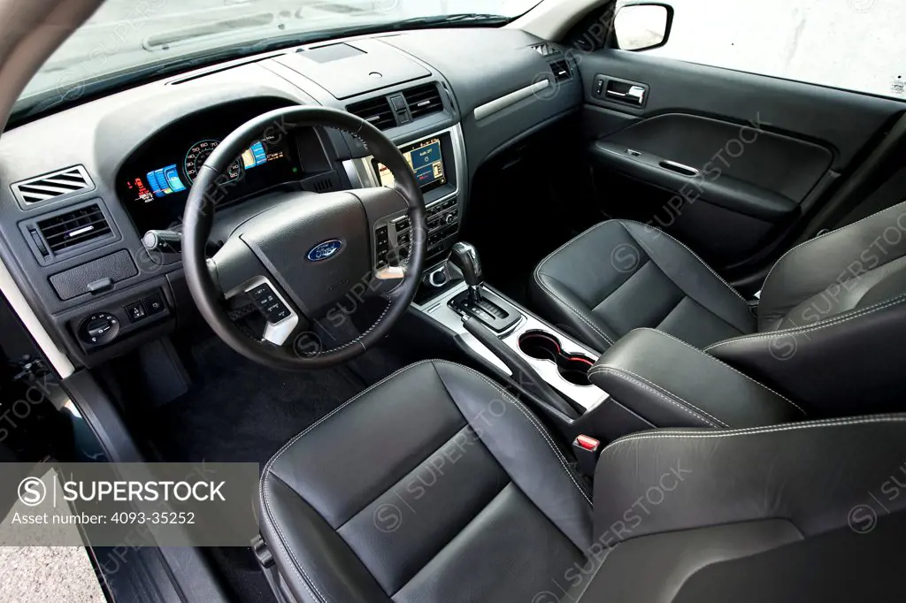 2010 Ford Fusion Hybrid showing the front seats, steering wheel, instrument panel and center console