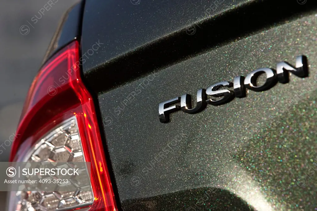 2010 Ford Fusion Hybrid showing the rear badge logo