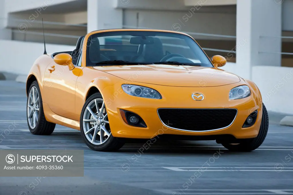 2010 Mazda MX-5 Miata in a parking structure, front 3/4 static view