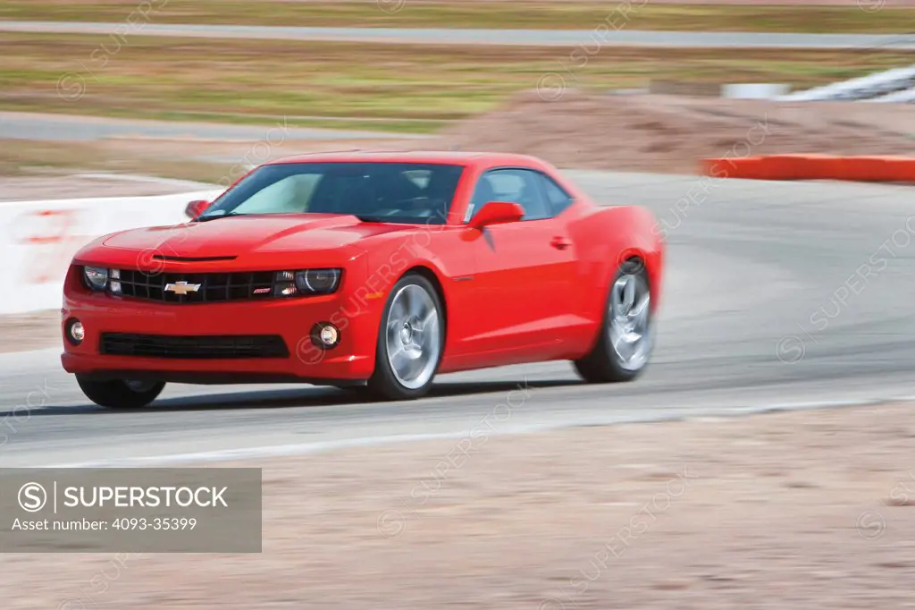 2010 Chevrolet Camaro SS on race track, front 3/4