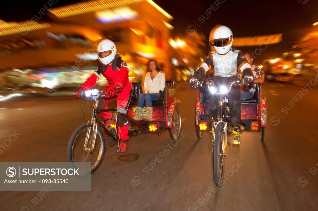 2010 Pedicabs racing thorugh city street at night
