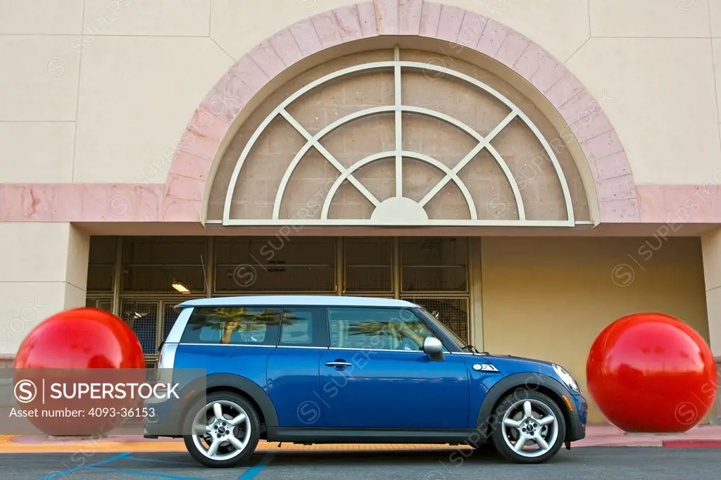 2008 Mini Cooper S Clubman parked in front of a suburban commercial building, side view