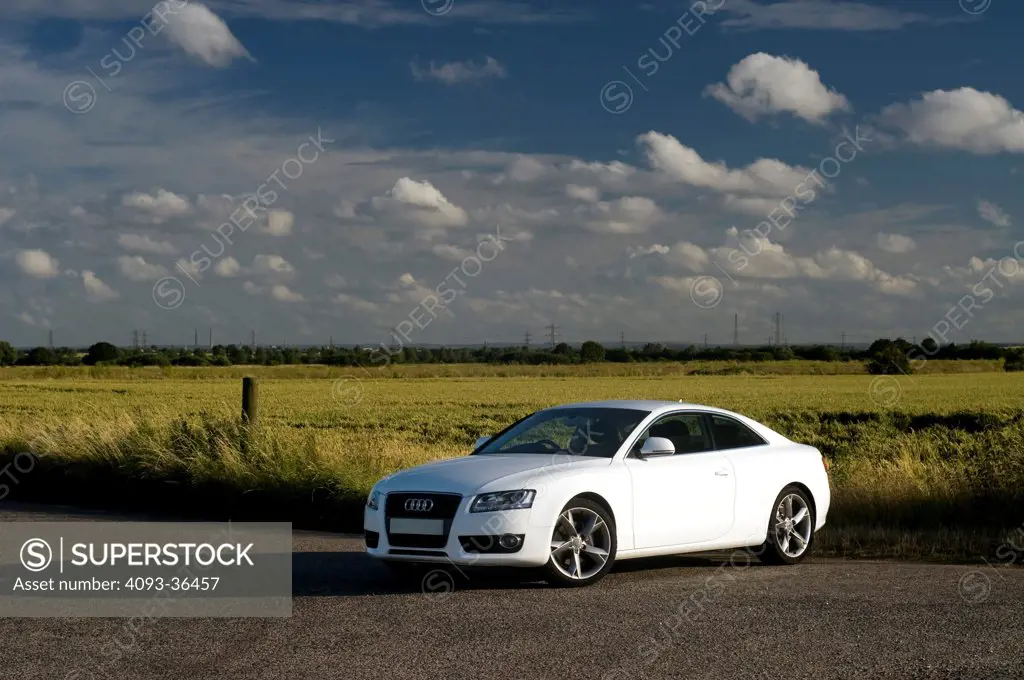 2010 Audi A5 on rural road, front 3/4