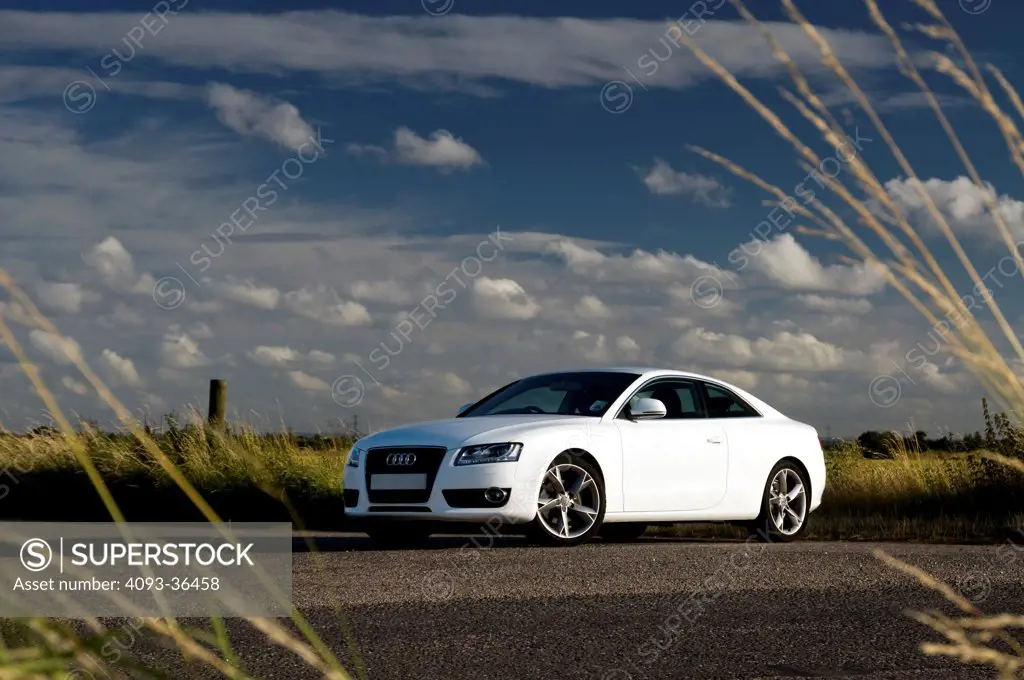2010 Audi A5 on rural road, front 3/4