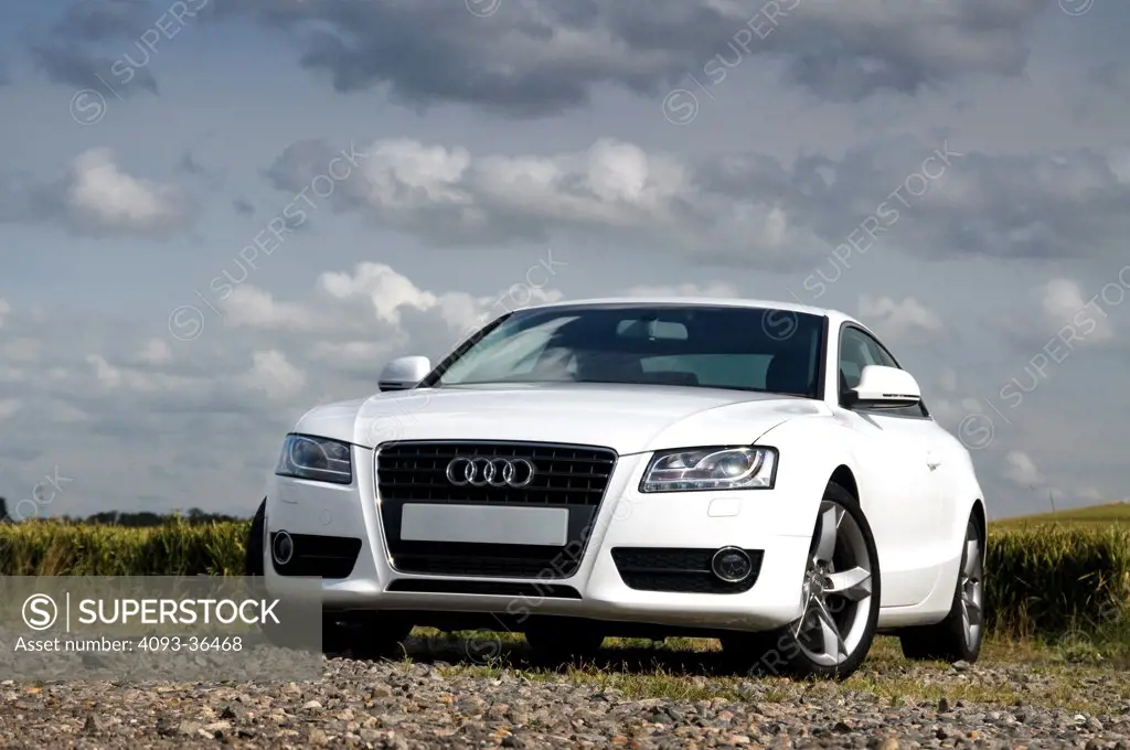 2010 Audi A5 parked on gravel in rural location, front 3/4