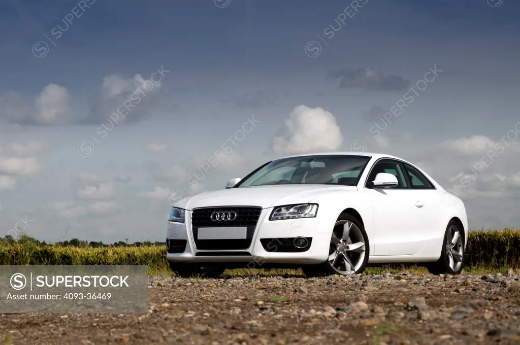 2010 Audi A5 parked on gravel in rural location, front 3/4