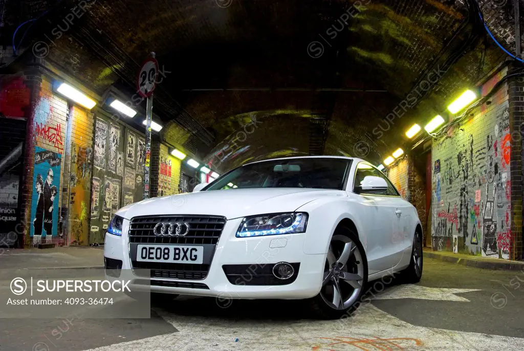 2010 Audi A5 parked in city tunnel at night, front 3/4