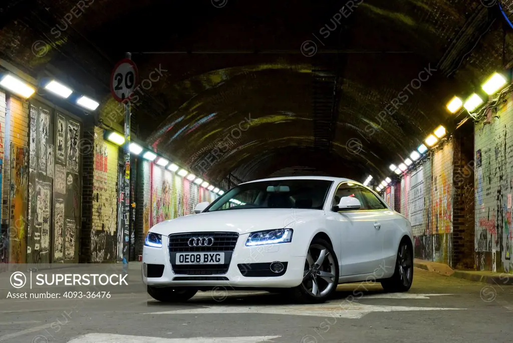 2010 Audi A5 parked in city tunnel at night, front 3/4