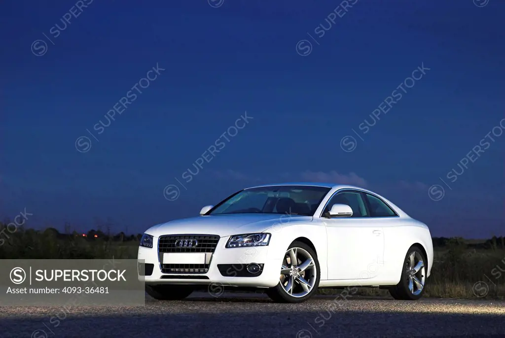 2010 Audi A5 parked on rural road at night, front 3/4