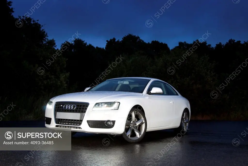 2010 Audi A5 parked on rural road, front 3/4