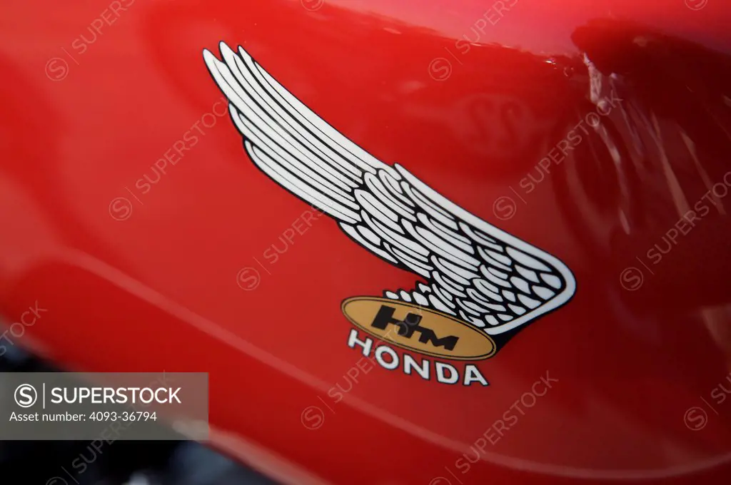 A closeup close-up detailed shot of a 1970 Honda Cr 750 wing logo