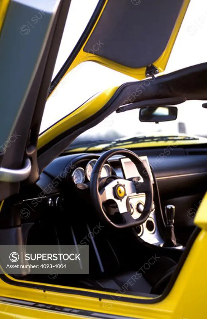 interior detail Saleen S7 2002 yellow open doors steering wheel