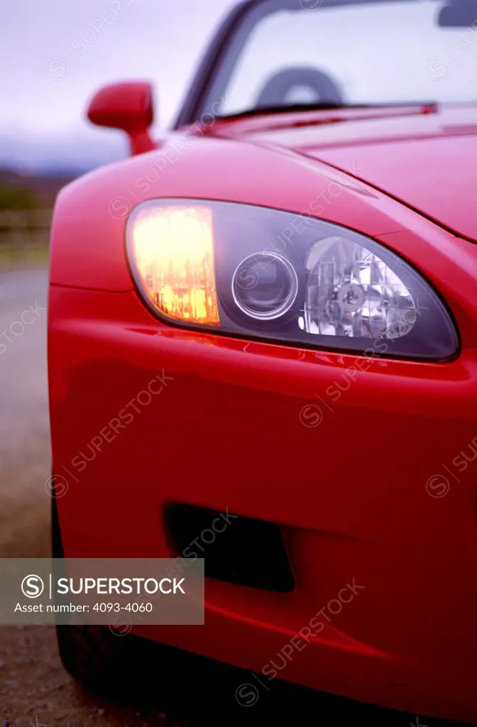 detail Honda S2000 2001 red nose headlight head on street