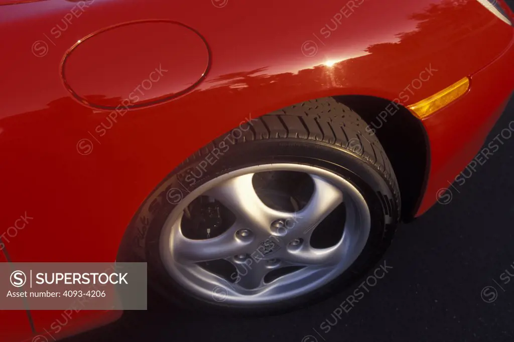 detail Porsche 911 Carrera 4 2001 red wheel tire fender fuel door gas cap turned