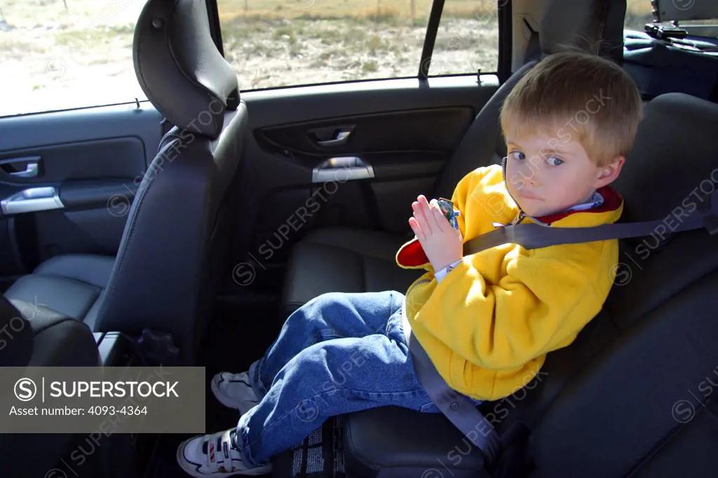 interior Volvo XC90 2005 child kid boy black leather seats