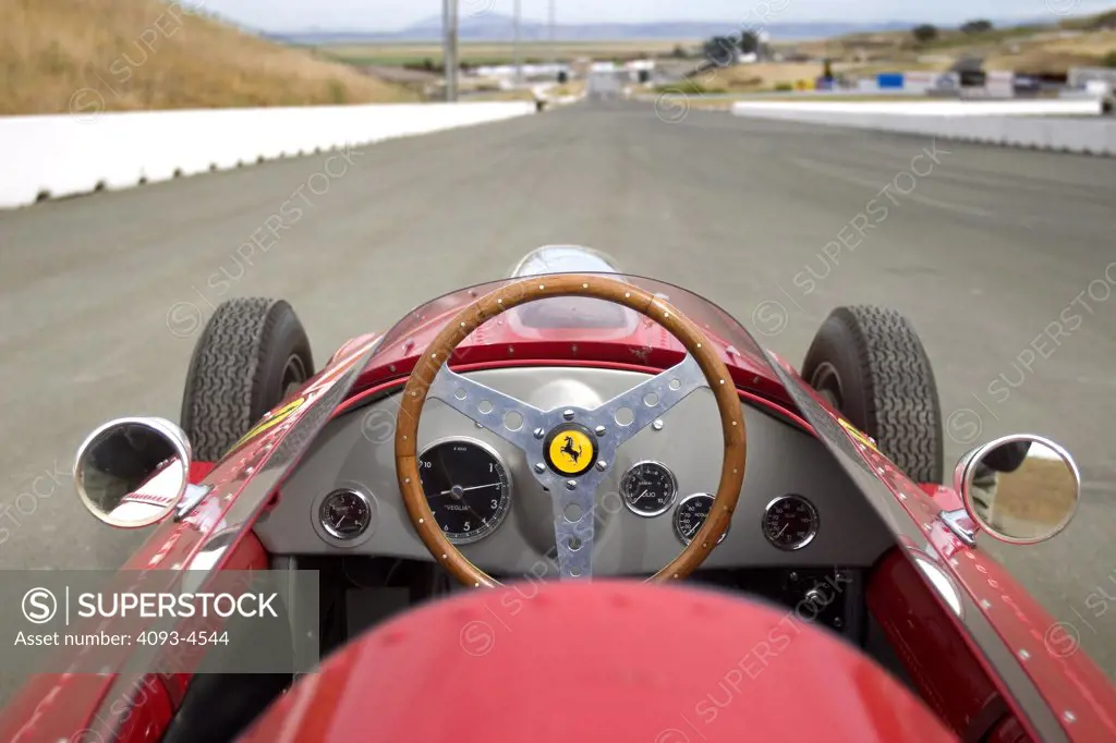 interior detail Ferrari 246 Dino red Formula One steering wheel wood gauges