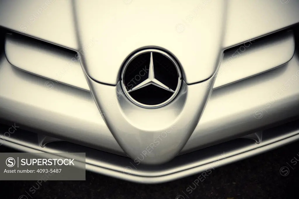 front nose of a benz logo badge on the grill