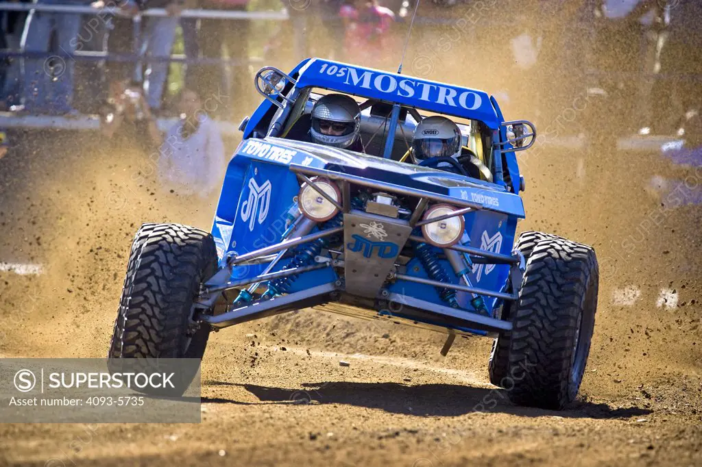 Custom Dirt racer dune buggy racing through the dirt and mud  Offroad Off road racing in the dirt desert