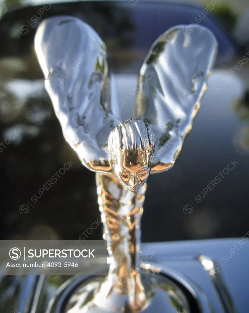 A close up detail shot of a Rolls Royce hood ornament