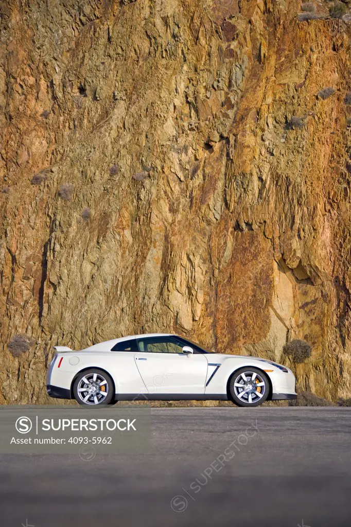 2008 Nissan GT-R GTR parked in front of a cliffside.  The Nissan GT-R is All-Wheel Drive with a twin-turbo 6 cylinder engine