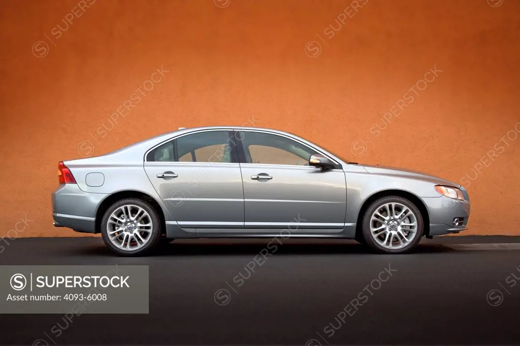 2008 Volvo S80 Side view in front of an orange wall.
