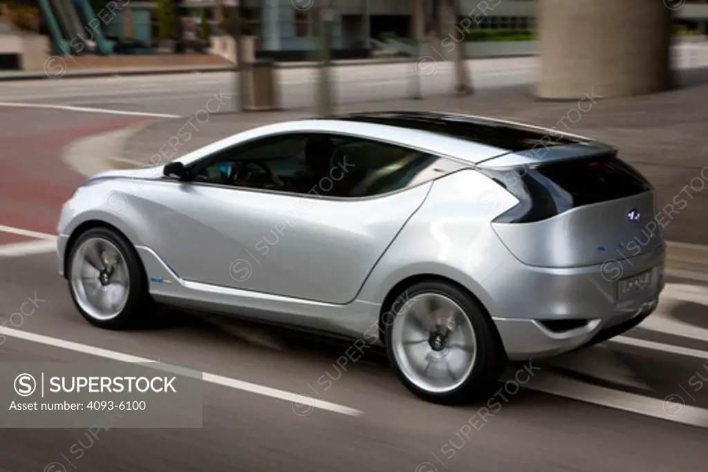 2009 Hyundai HCD-11 Nuvis Concept car driving through city, rear 7/8